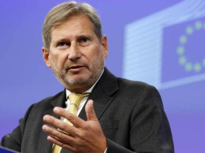 When can macrofinancial assistance be resumed, according to EU Commissioner Johannes Hahn